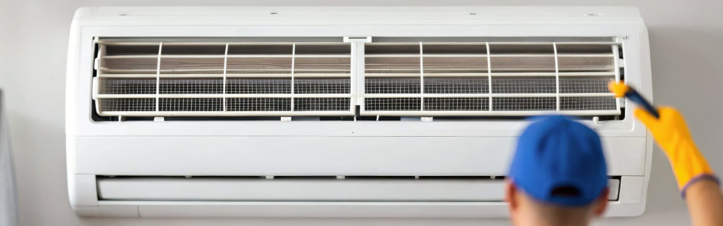 HVAC contractor working on heating and cooling equipment